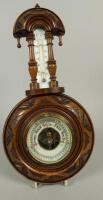 A Victorian walnut aneroid barometer