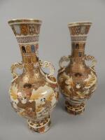 A pair of late 19thC / early 20thC Japanese earthenware two handled vases