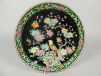 A Chinese famille noire saucer dish