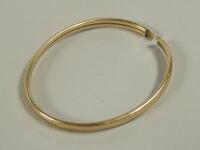 A 9ct gold bangle