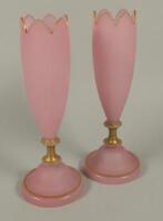 A pair of Victorian pink opaque glass vases