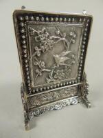 A Chinese miniature white metal menu holder