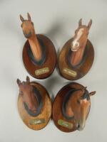 A set of four Beswick matt glazed busts of race horses