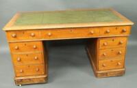 A Victorian oak twin pedestal desk