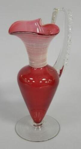 A Victorian cranberry glass ewer