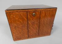 An early 20thC oak smokers cupboard