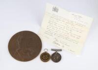 A WWI medal pair and bronze memorial plaque