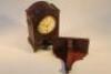 A Regency mahogany and brass inlaid mantel clock and stand