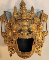 A Chinese gilt metal hanging wall mask