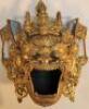 A Chinese gilt metal hanging wall mask