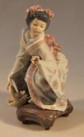 A Lladro figure of a geisha girl