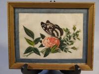 A Chinese painting on rice paper of a butterfly on a rose