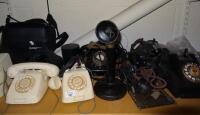 A quantity of bakelite and other telephones