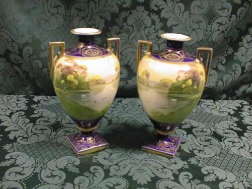 A pair of Noritake 2 handled urns of ovoid form