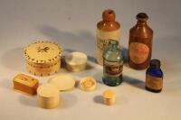 A quantity of early 20thC ivory bone and resin jars