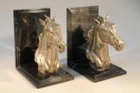 A pair of white metal and marble finish book ends