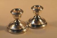 A pair of Elizabeth II silver dwarf candlesticks