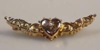 A Edwardian 9ct gold bar brooch