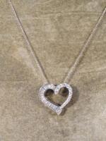 An 18ct white gold pendant and chain