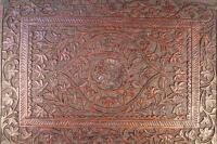 A heavily carved hardwood panel of rectangular form