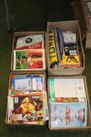 A quantity of various football programmes