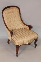 A 19thC walnut framed nursing chair