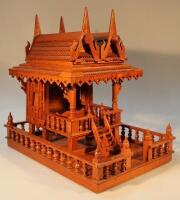 A heavily carved hardwood model of an oriental spirit house