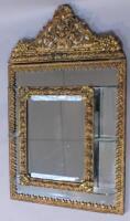 A gilt metal hanging mirror