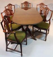 A modern harlequin mahogany finish dining room suite