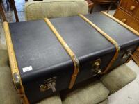 A pressed leather steamer style trunk