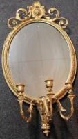 An Empire style giltwood girandole