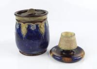 A Royal Doulton stoneware tobacco jar and a Wedgwood match holder/striker