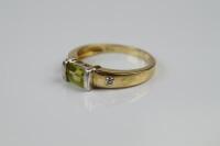 A modern 9ct gold and peridot ring