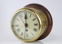 An early 20thC brass cased cylinder bulk head clock