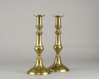 A pair of 19thC brass candlesticks