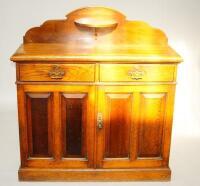 An Edwardian oak sideboard