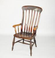 A Victorian beech and elm lathback grandfather armchair