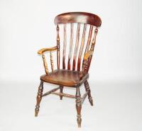 A Victorian beech and elm lathback grandfather armchair