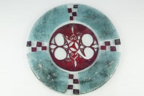 A modern circular studio glass dish