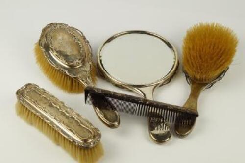 An Edwardian silver mounted dressing table set