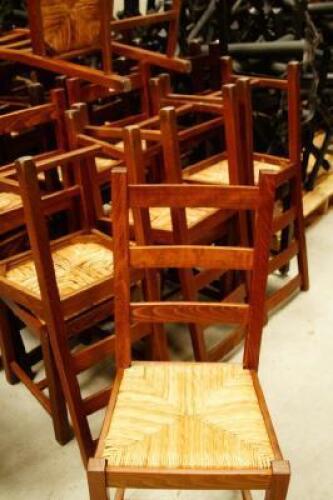 Twenty beech rush seated ladderback chairs.