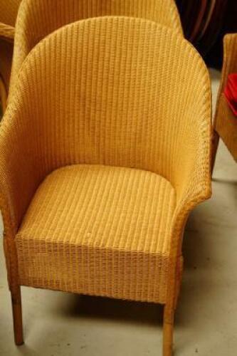 Four Lloyd Loom tub chairs.