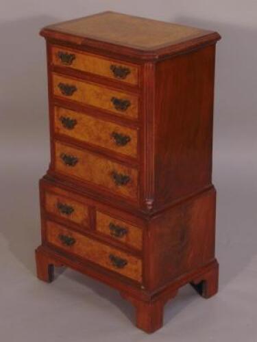 A walnut and burr walnut miniature chest on chest