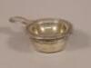 A Continental white metal tea strainer and bowl