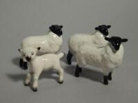 Four Beswick lambs