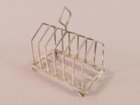 An Edwardian silver six division toast rack