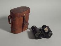 A pair of early 20thC French military issue binoculars