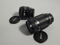 Two Nikon camera lenses