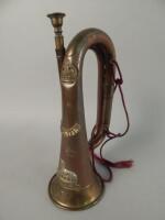 A military brass bugle and mouthpiece