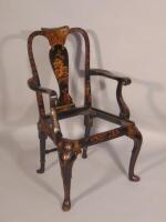 An early 20thC black Japanned open armchair